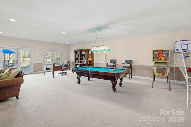 recreation room featuring light colored carpet, recessed lighting, baseboards, french doors, and ornamental molding