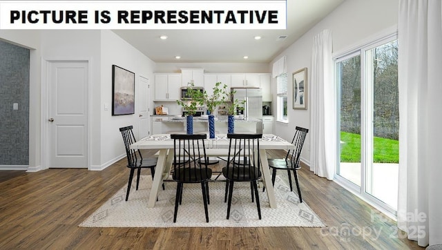 dining room featuring dark wood-style flooring, plenty of natural light, and baseboards