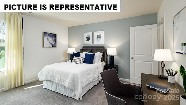 bedroom featuring carpet and baseboards