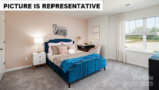 carpeted bedroom featuring visible vents and baseboards