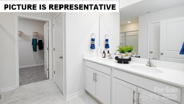 full bathroom featuring a stall shower, visible vents, a sink, and double vanity