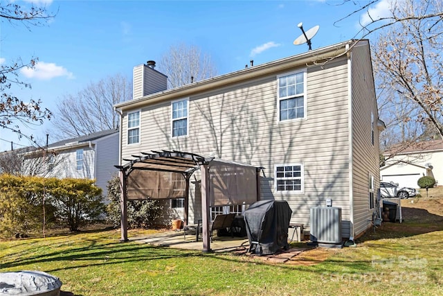 back of property with a patio, central AC, a lawn, a pergola, and a chimney