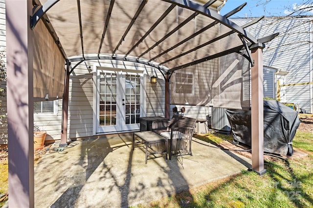 view of patio featuring a pergola and french doors