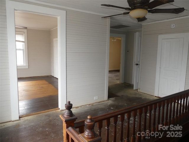 hall with crown molding and wood finished floors