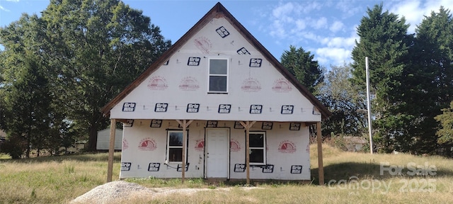 unfinished property featuring a porch