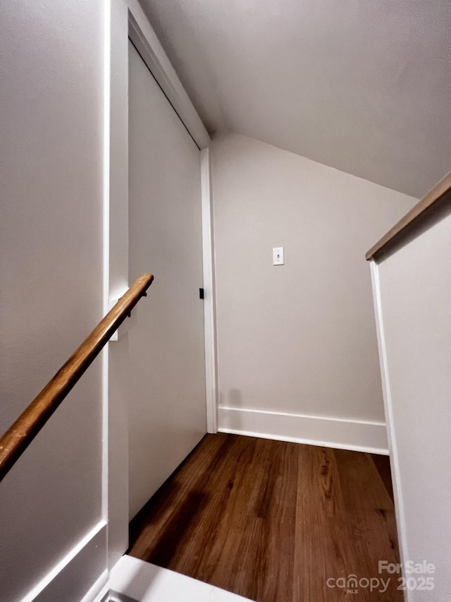 stairs with baseboards and wood finished floors