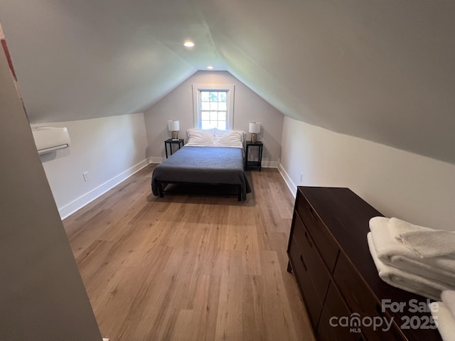 bedroom featuring baseboards, vaulted ceiling, wood finished floors, and recessed lighting