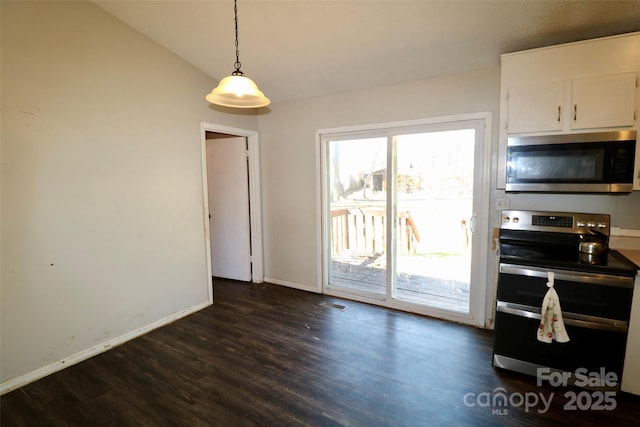 kitchen featuring white cabinetry, baseboards, hanging light fixtures, appliances with stainless steel finishes, and dark wood finished floors