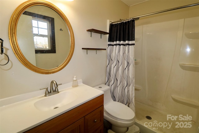 bathroom featuring toilet, vanity, and a shower with shower curtain