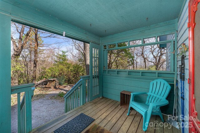 unfurnished sunroom with a healthy amount of sunlight