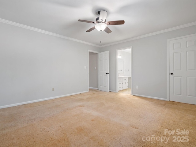 unfurnished bedroom featuring light carpet, ornamental molding, ensuite bath, and baseboards