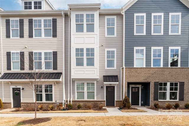 view of property with brick siding