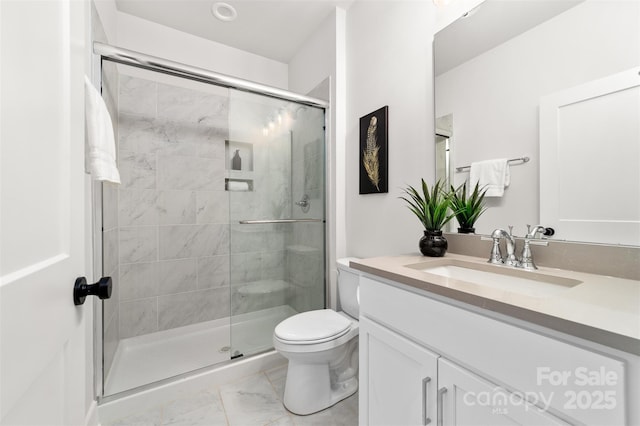 full bathroom with toilet, marble finish floor, a shower stall, and vanity