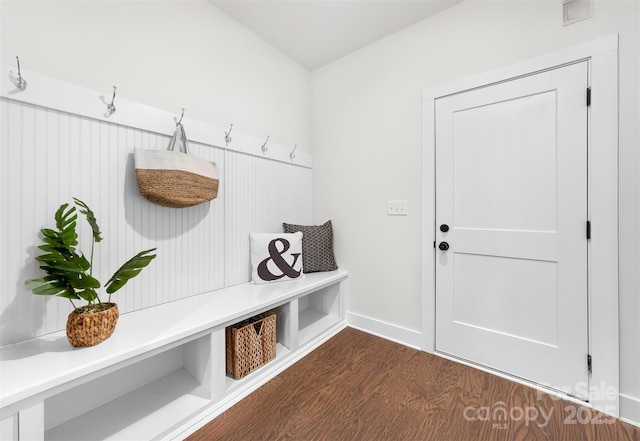 mudroom featuring baseboards, visible vents, and dark wood-style flooring