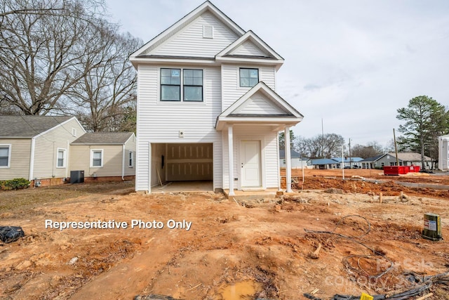 view of front of property with cooling unit, a residential view, and an attached garage