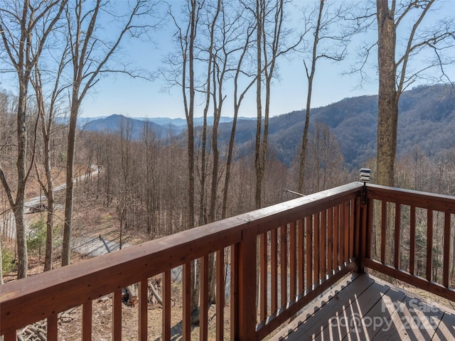 wooden deck featuring a mountain view