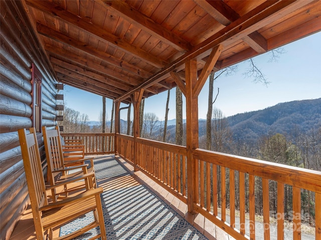 wooden deck with a mountain view