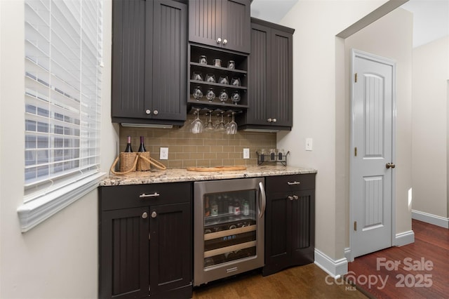 bar with a bar, tasteful backsplash, wine cooler, and dark wood-type flooring