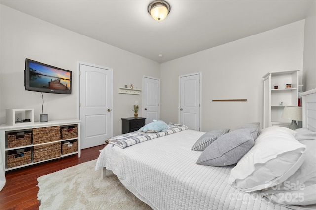 bedroom with wood finished floors