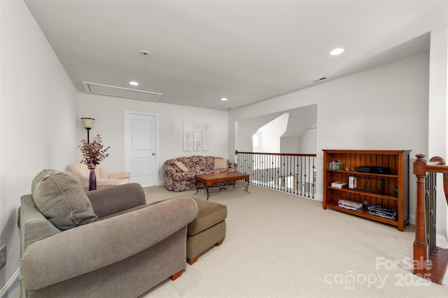 carpeted living room featuring attic access, recessed lighting, and visible vents