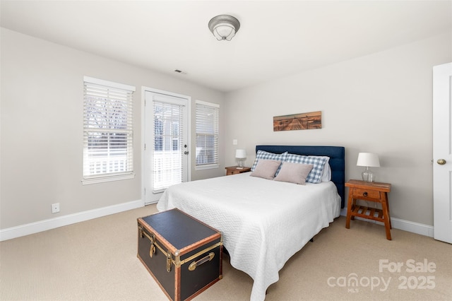 bedroom featuring access to exterior, light colored carpet, visible vents, and baseboards