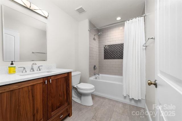 full bath featuring toilet, visible vents, shower / bath combo with shower curtain, and vanity