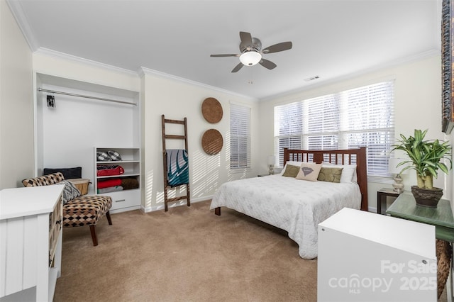 bedroom featuring ceiling fan, ornamental molding, visible vents, and light colored carpet