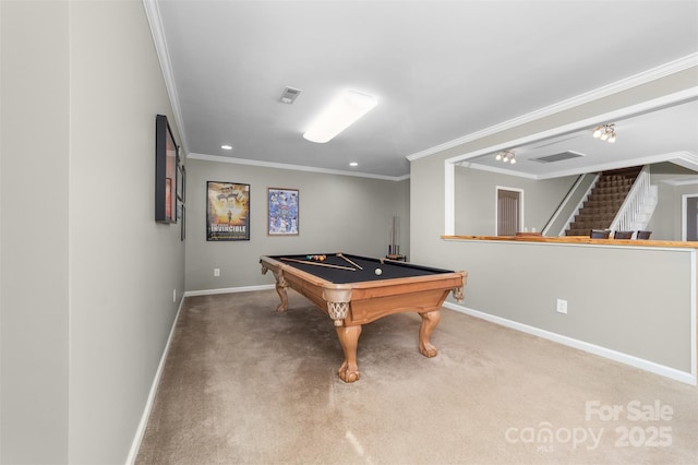 rec room with carpet floors, visible vents, and crown molding