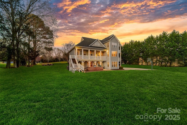 back of property featuring a yard