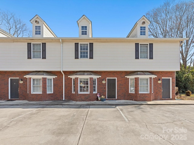 multi unit property featuring brick siding