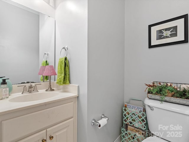 bathroom with vanity and toilet