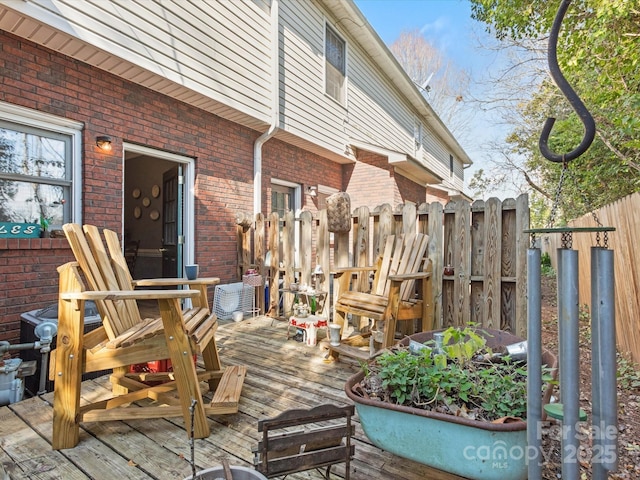 wooden deck featuring fence