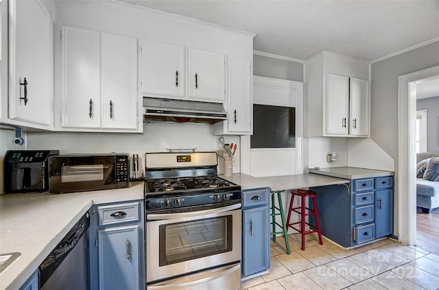 kitchen with appliances with stainless steel finishes, white cabinets, blue cabinets, and under cabinet range hood