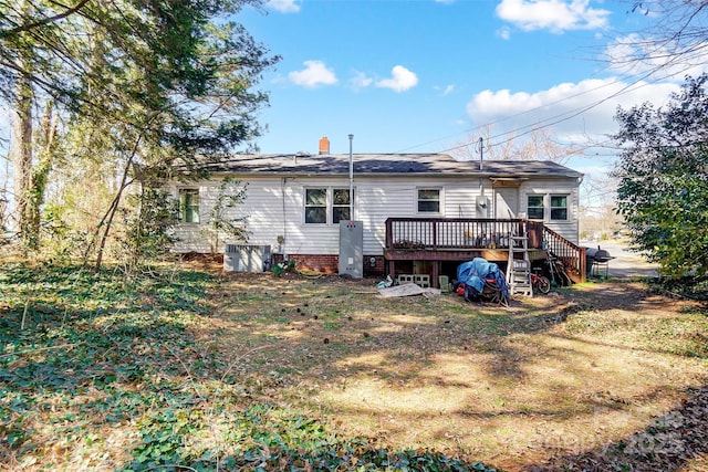 back of house with stairway and a wooden deck