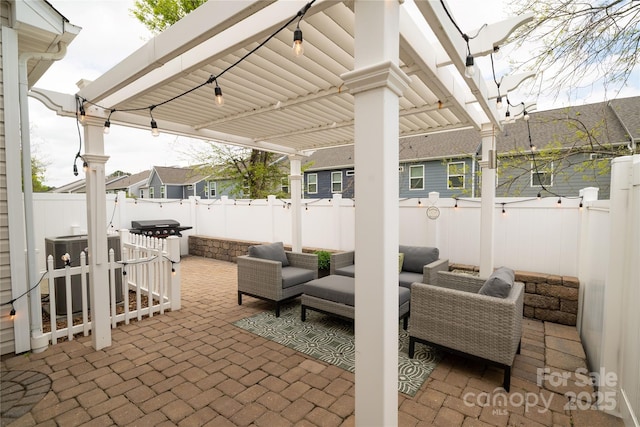 view of patio featuring a fenced backyard, an outdoor living space, and cooling unit