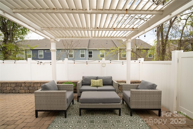 view of patio with a fenced backyard, an outdoor living space, and a pergola