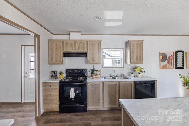 kitchen featuring dark wood-style flooring, a sink, under cabinet range hood, and black appliances