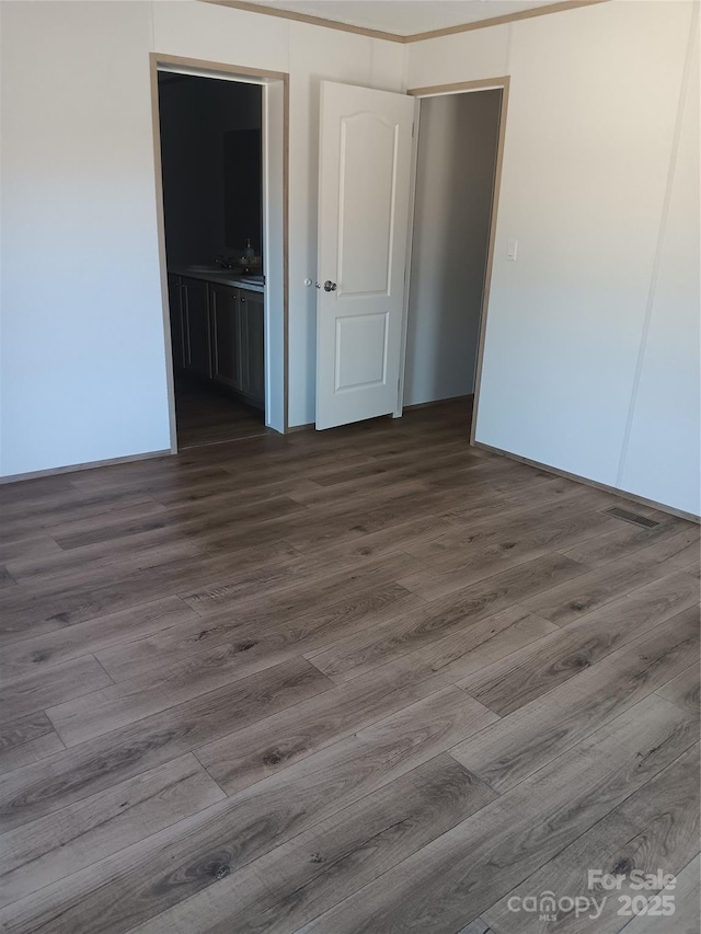 empty room with dark wood-style floors