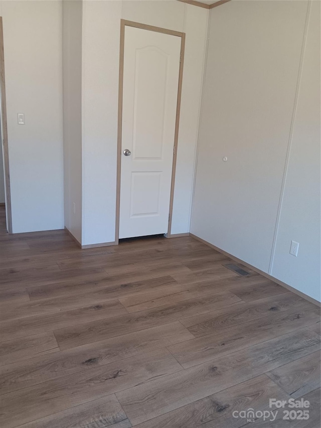 unfurnished room featuring wood finished floors