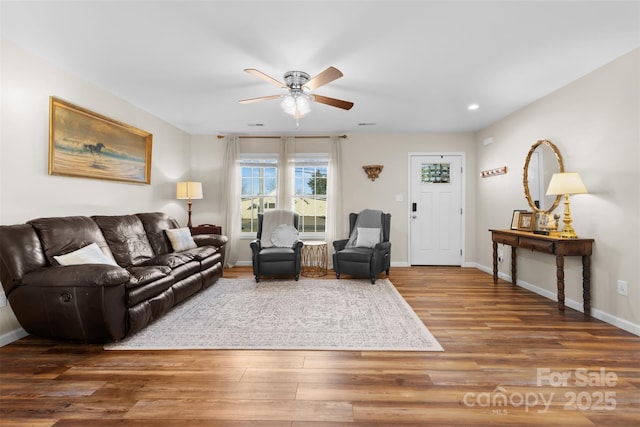 living room featuring recessed lighting, ceiling fan, baseboards, and wood finished floors