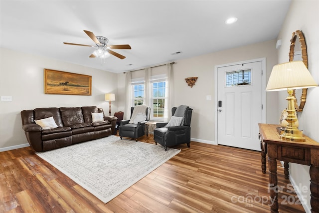 living room featuring recessed lighting, visible vents, ceiling fan, wood finished floors, and baseboards