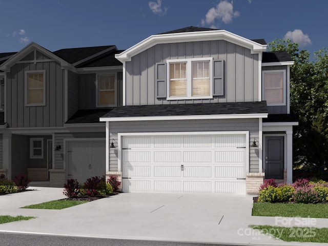 view of front of home with a garage, concrete driveway, and board and batten siding