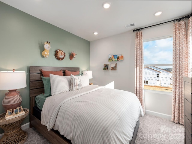 carpeted bedroom with baseboards, visible vents, and recessed lighting