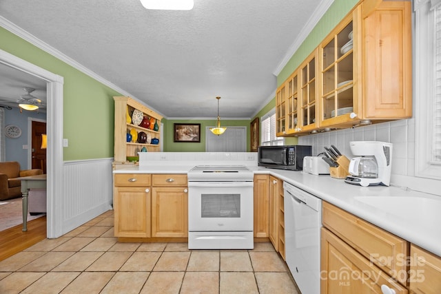 kitchen with white appliances, glass insert cabinets, and light countertops