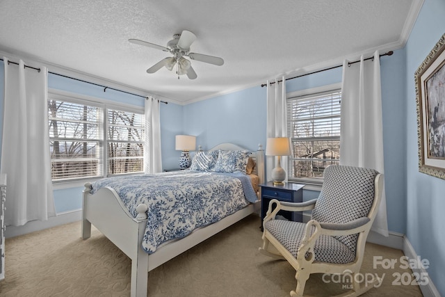 bedroom featuring a textured ceiling, light colored carpet, a ceiling fan, baseboards, and ornamental molding