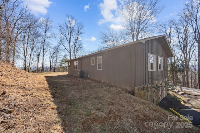 view of side of property featuring central AC