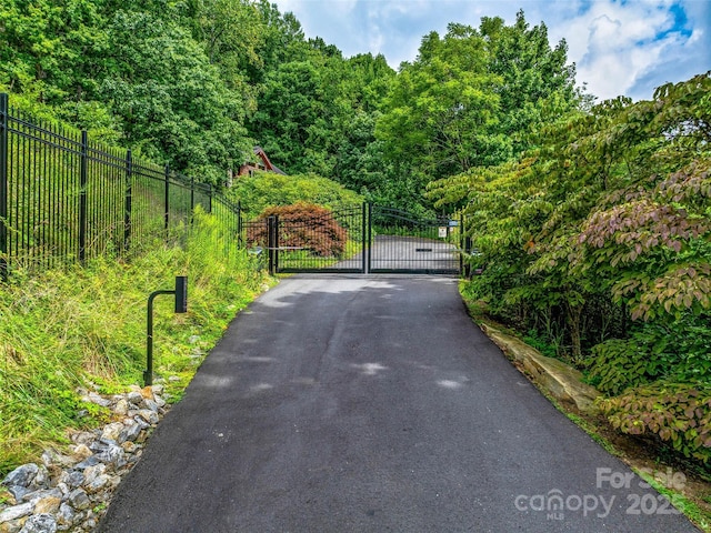 view of street featuring a gate