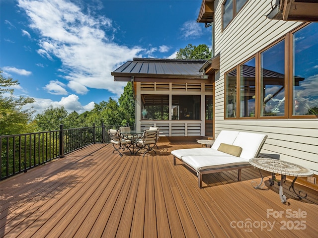 wooden deck with outdoor dining area