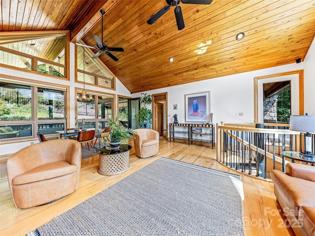 interior space with lofted ceiling with beams, wooden ceiling, and ceiling fan with notable chandelier