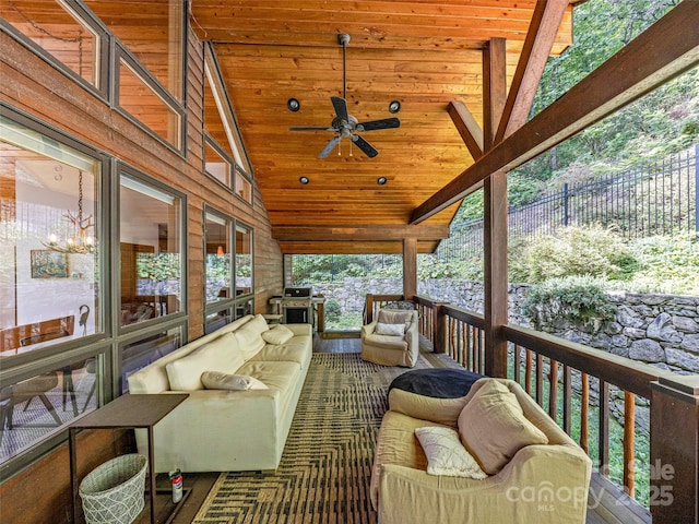 deck featuring a ceiling fan, fence, and an outdoor hangout area